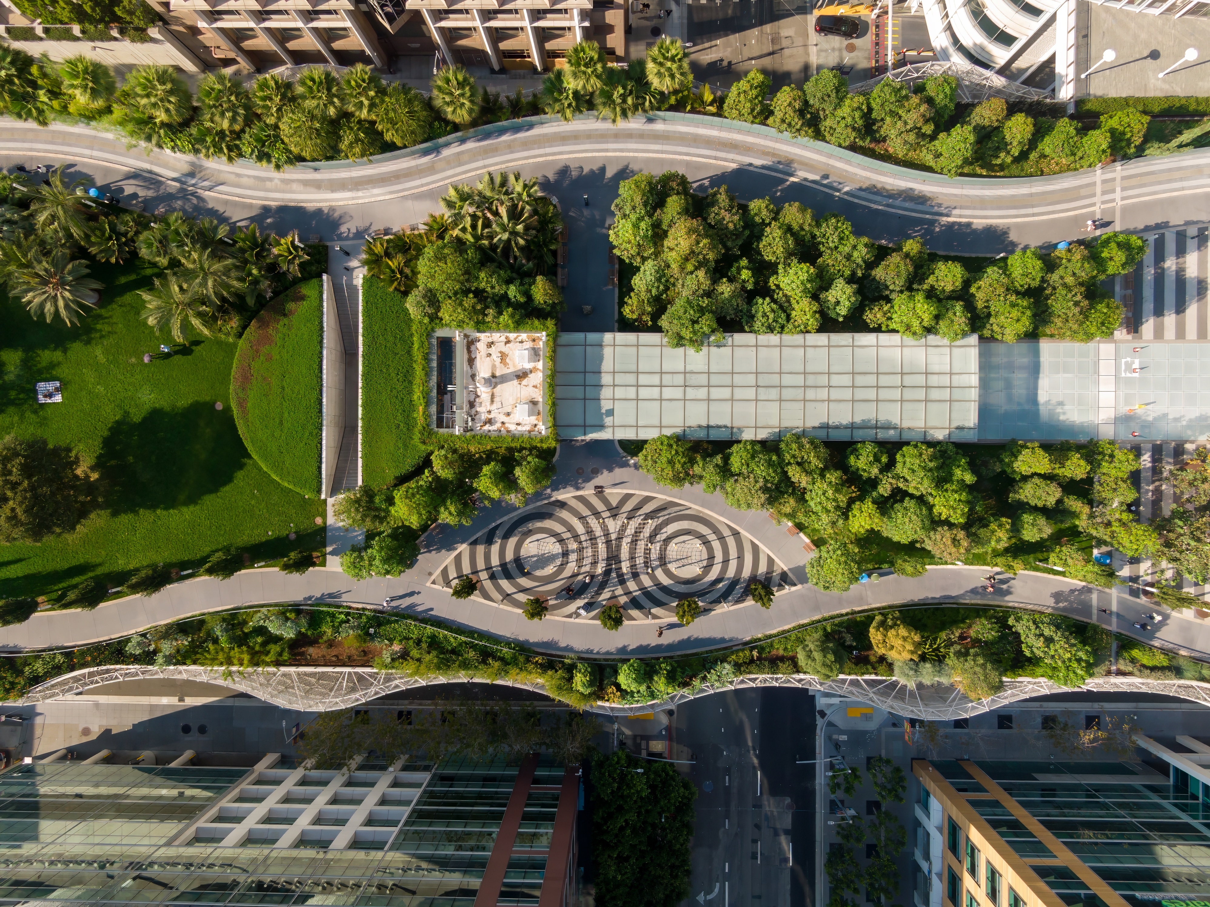 Aerial view of Salesforce Park in San Francisco, California, USA. People are walking and relaxing in the park, enjoying the green space and urban oasis.